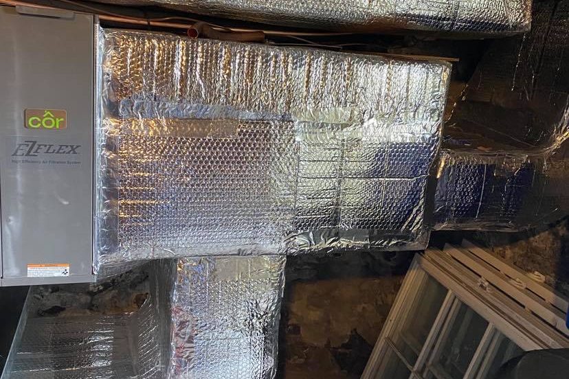 Air handler and insulated ductwork installed by Peabody Huggins
