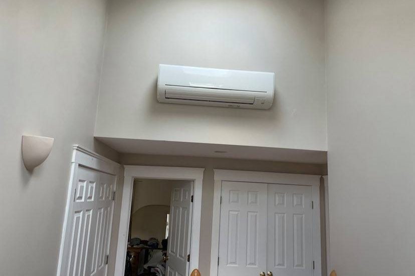 Ductless mini-split installed in an upstairs hallway by Peabody Huggins